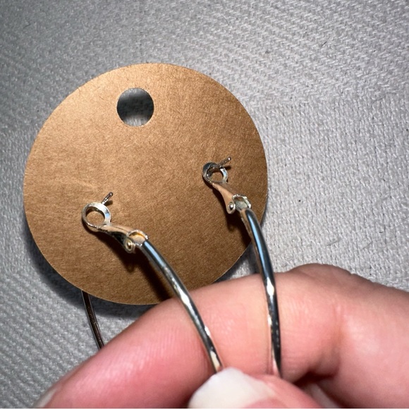 Silver toned medium hoop bangle earrings - Picture 3 of 4